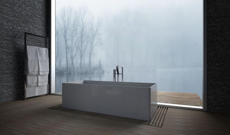 A Bathroom in the West Hills of Portland with a large picture window in front of a stand alone bathtub, dark walls and flooring and simple towel rack to help illustrate what is Hygge Design