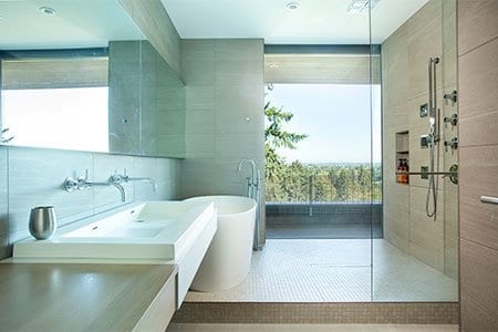Sleek, luxury bathroom with a large window at the end to help illustrate How Long Does It Take to Remodel a Bathroom