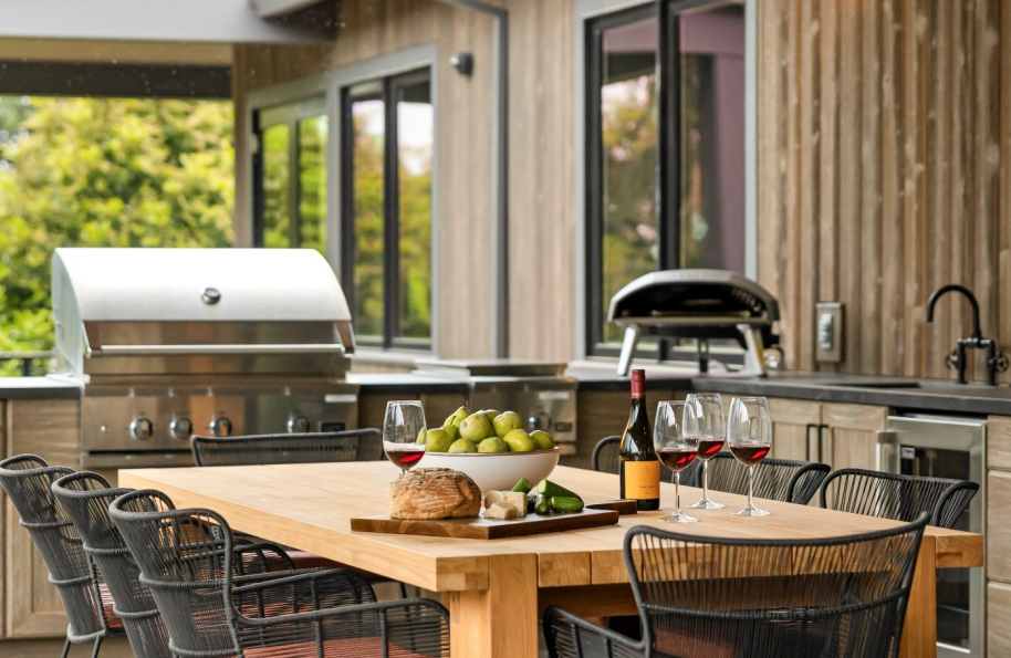 A luxury outdoor kitchen and dining space